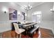 Stylish dining room featuring modern decor, a unique table setting, and ample lighting at 5202 Logan Ln, Indianapolis, IN 46250