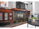Living room fireplace with custom wood trim, slate surround, and built-in cabinets at 5202 Logan Ln, Indianapolis, IN 46250