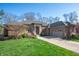 Attractive brick home with a well-kept lawn and inviting curb appeal at 5202 Logan Ln, Indianapolis, IN 46250