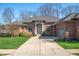 Charming brick home with a well-manicured lawn and inviting front entrance at 5202 Logan Ln, Indianapolis, IN 46250