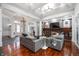 Open-concept living room with a fireplace, comfortable seating, and stylish decor at 5202 Logan Ln, Indianapolis, IN 46250