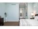 Bright main bedroom boasts light blue walls with an ensuite bathroom at 5202 Logan Ln, Indianapolis, IN 46250