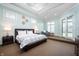 Spacious main bedroom features trey ceilings, skylights, large windows, and French doors to the backyard at 5202 Logan Ln, Indianapolis, IN 46250