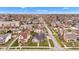 An aerial view of a quaint neighborhood with charming homes and tree-lined streets under a clear, blue sky at 524 N Meridian St, Lebanon, IN 46052