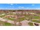 Aerial view showcasing a vibrant park with playground, green spaces, parking and picnic areas under a partly cloudy sky at 524 N Meridian St, Lebanon, IN 46052