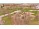 A beautiful aerial showcases an expansive park with playgrounds, grassy fields, and mature trees on a partly cloudy day at 524 N Meridian St, Lebanon, IN 46052