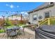 Backyard patio featuring seating, outdoor grill, and stylish string lights, ideal for entertaining guests at 524 N Meridian St, Lebanon, IN 46052
