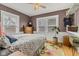 Bright bedroom features hardwood floors, neutral walls, and two bright, natural light filled windows at 524 N Meridian St, Lebanon, IN 46052
