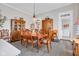 Traditional dining room featuring a wood table, upholstered chairs, and vintage hutch for a classic aesthetic at 524 N Meridian St, Lebanon, IN 46052