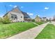 Beautiful house featuring stone accents, a manicured lawn, and a sidewalk at 524 N Meridian St, Lebanon, IN 46052