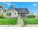 Charming home featuring stone accents, a manicured lawn, and a cozy front porch at 524 N Meridian St, Lebanon, IN 46052