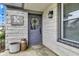 Charming front door featuring a wreath, brick accents, and a welcoming porch area at 524 N Meridian St, Lebanon, IN 46052