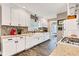 Bright kitchen with white cabinets, granite countertops, mosaic backsplash, and stainless steel appliances at 524 N Meridian St, Lebanon, IN 46052