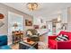 Inviting living room flowing into a bright kitchen with white cabinets and modern appliances at 524 N Meridian St, Lebanon, IN 46052
