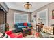 Stylish living room featuring designer furniture, a vibrant rug, and ample natural light at 524 N Meridian St, Lebanon, IN 46052