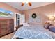 Comfortable bedroom with queen bed and media cabinet with mounted television at 524 N Meridian St, Lebanon, IN 46052