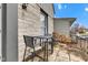 Cozy patio features a metal table and chairs with colorful cushions, perfect for outdoor relaxation and entertaining at 524 N Meridian St, Lebanon, IN 46052