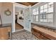Bright sunroom leading to the kitchen, featuring ample windows and stylish decor at 524 N Meridian St, Lebanon, IN 46052