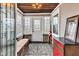 Charming sunroom featuring ample windows, a wooden ceiling, and a cozy seating area at 524 N Meridian St, Lebanon, IN 46052