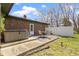 Backyard with a hot tub and dining set near the brick home at 5344 Tincher Rd, Indianapolis, IN 46221