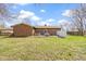 Backyard features a patio with hot tub, grill, and lush lawn at 5344 Tincher Rd, Indianapolis, IN 46221