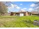 Spacious backyard featuring a brick house and lush lawn at 5344 Tincher Rd, Indianapolis, IN 46221
