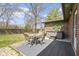 Backyard with a hot tub, patio table and chairs at 5344 Tincher Rd, Indianapolis, IN 46221