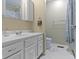 Bright bathroom featuring a white vanity and marble-like floors at 5344 Tincher Rd, Indianapolis, IN 46221
