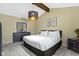 Relaxing bedroom features a queen-sized bed, neutral walls and dark wood accents at 5344 Tincher Rd, Indianapolis, IN 46221