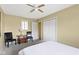 Sunlit bedroom with a ceiling fan, closet, and comfortable seating area at 5344 Tincher Rd, Indianapolis, IN 46221