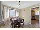Dining room features table, curtains, decorative chandelier, and entry to kitchen at 5344 Tincher Rd, Indianapolis, IN 46221