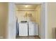 Laundry room with white washer and dryer inside of closet at 5344 Tincher Rd, Indianapolis, IN 46221