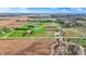 Wide aerial perspective of farmland interspersed with ponds, roads, and various structures at 5442 W 400 N, Fairland, IN 46126