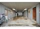 Interior view of barn with concrete floor, electrical, and an open door at 5442 W 400 N, Fairland, IN 46126