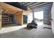 Open barn interior featuring concrete floors, high ceilings, and access to the outside at 5442 W 400 N, Fairland, IN 46126