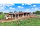 Fenced-in barn with several animal enclosures, suitable for livestock or poultry at 5442 W 400 N, Fairland, IN 46126