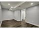 The basement has recessed lighting, gray walls, and a white door frame at 5442 W 400 N, Fairland, IN 46126