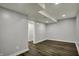 Spacious basement features modern wood flooring, gray walls and recessed lighting at 5442 W 400 N, Fairland, IN 46126