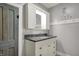 Bathroom with granite countertop vanity, grey walls, a decorative mirror and towel rack for added convenience at 5442 W 400 N, Fairland, IN 46126