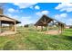 Outdoor view featuring a wooden pavilion and open sided structure surrounded by green grass at 5442 W 400 N, Fairland, IN 46126