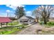Charming home with a covered porch and well-maintained lawn with a curved sidewalk at 5442 W 400 N, Fairland, IN 46126