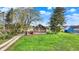 Quaint property showcasing a well-maintained lawn, charming home exterior, and mature trees at 5442 W 400 N, Fairland, IN 46126