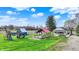 Exterior shot of home and playground with a red roofed structure and lush green lawn at 5442 W 400 N, Fairland, IN 46126