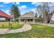 Charming single-story home with well-maintained lawn, sidewalk and inviting front porch at 5442 W 400 N, Fairland, IN 46126