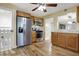 Cozy kitchen with stainless steel appliances, wood cabinets, and wood-look flooring that adds warmth at 5442 W 400 N, Fairland, IN 46126