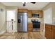 Bright kitchen features stainless steel appliances and wooden cabinets for a modern and functional cooking space at 5442 W 400 N, Fairland, IN 46126