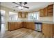 Kitchen area with stainless steel appliances, a view to other living areas, and wood-look flooring at 5442 W 400 N, Fairland, IN 46126