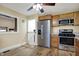 Charming kitchen with a stainless steel refrigerator and range, offering a blend of style and functionality at 5442 W 400 N, Fairland, IN 46126