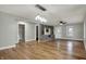 Bright living room features hardwood floors, neutral walls, and built-in shelving with stylish lighting at 5442 W 400 N, Fairland, IN 46126