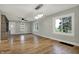 Spacious living room boasts hardwood floors, built-in shelving, and large windows offering natural light at 5442 W 400 N, Fairland, IN 46126